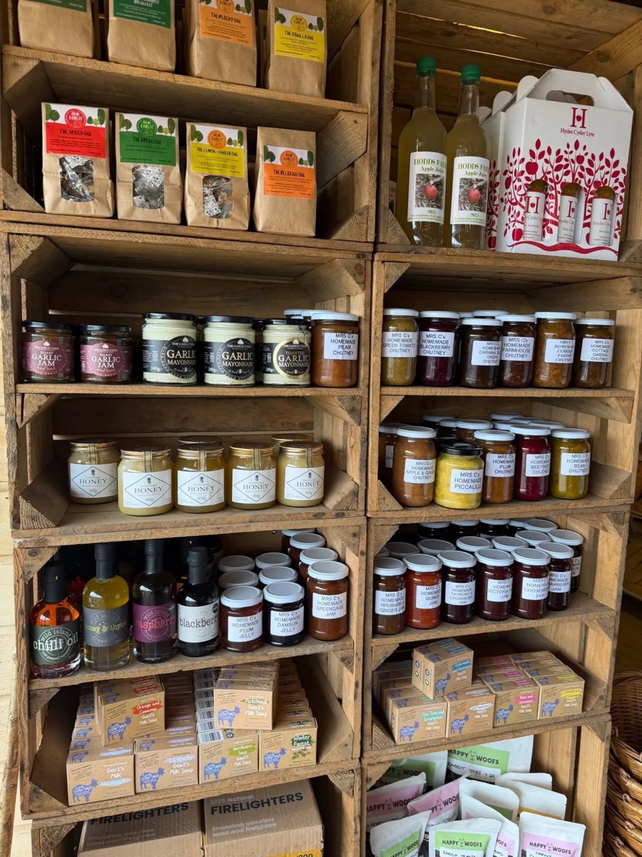 Crate shelves of local honey, homemade chutneys and jams, oils and goat&rsquo;s milk soap